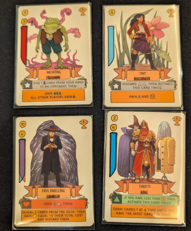 Sleeved Misfit Heroes cards showing character art over attribute banners with cost values
