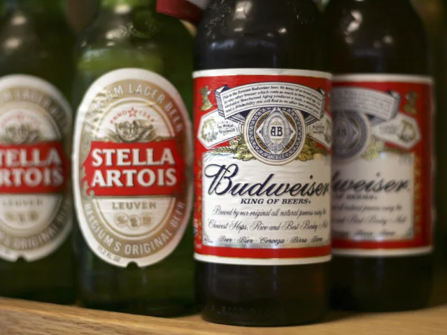 Budweiser and Stella Artois bottles side by side