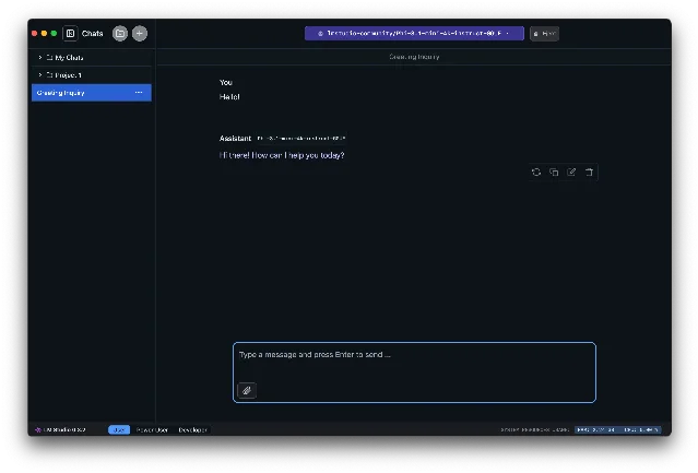 LM Studio 官方文档中的 Chat 界面截图：顶部是模型选择下拉框，显示 lmstudio-community/Phi-3.1-mini-4k-instruct-GGUF，右侧有 Eject 按钮；左侧边栏是 chats 目录树；中间是对话区，内容是 You: Hello 与 Assistant: Hi there! How can I help you today?；底部状态栏左侧写着 LM Studio 0.3.2 和 User / Power User / Developer 三个模式切换，右侧写着 SYSTEM RESOURCES USAGE: RAM: 2.24 GB | CPU: 0.00 %