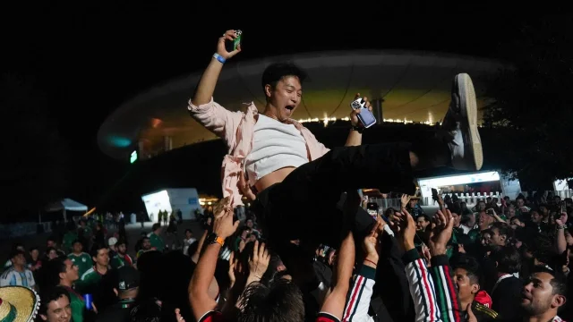 South Korean and Mexican fans celebrate together