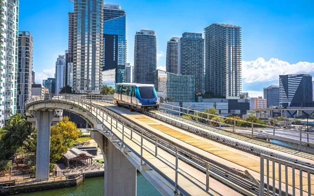 Metromover train with Downtown Miami skyline