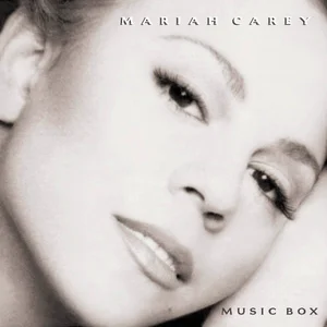 The black-and-white album artwork shows Mariah Carey looking downward in close-up