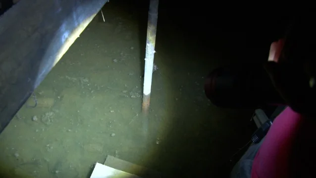 A flooded basement in a West Virginia home, photographed during the recovery effort