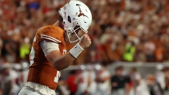 Texas Longhorns players celebrate their fourth-quarter comeback victory