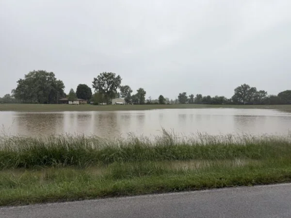 Central Indiana farmland flooded under grey skies, May-June 2026
