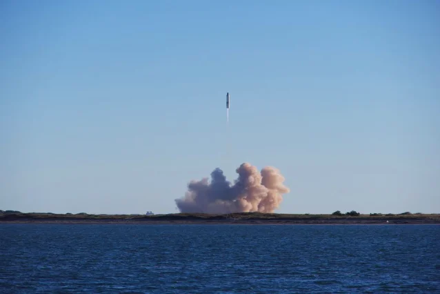 SpaceX Starship rocket launching from South Padre Island with smoke cloud over the water