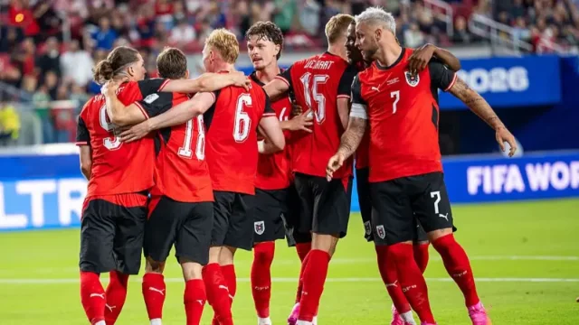 Austria players celebrate after beating Jordan