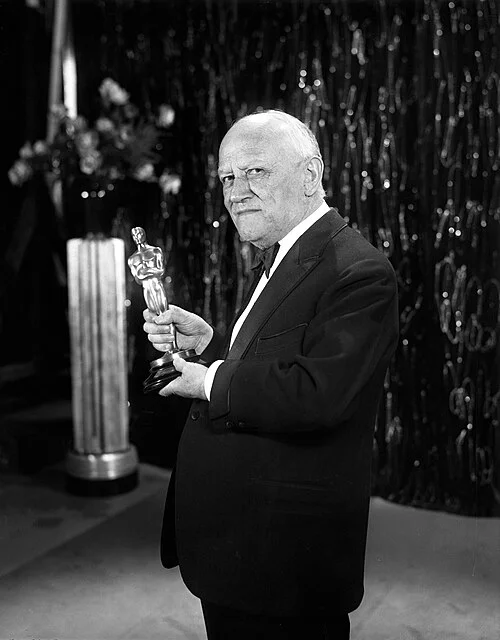 Carl Laemmle holding the Academy Award for Best Picture, 3rd Academy Awards, 1930