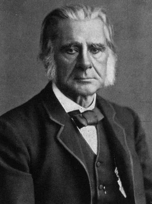 Thomas Henry Huxley in a black-and-white historical portrait