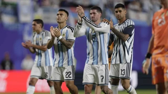 Argentina players applaud after the Algeria win