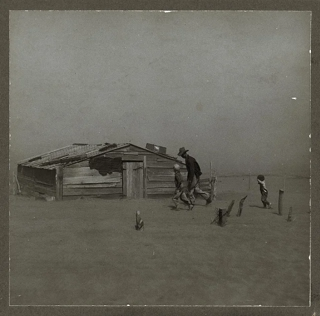 Original black-and-white Dust Bowl photograph of farmer and two sons walking toward a shed