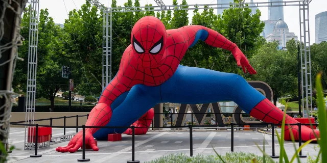 Giant Spider-Man installation in a city plaza