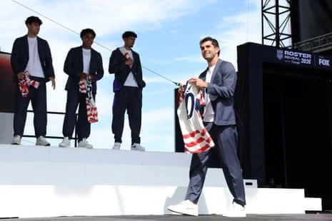 Christian Pulisic poses with his jersey during the United States World Cup roster reveal