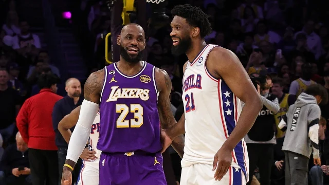 LeBron James and Joel Embiid greet each other on the court