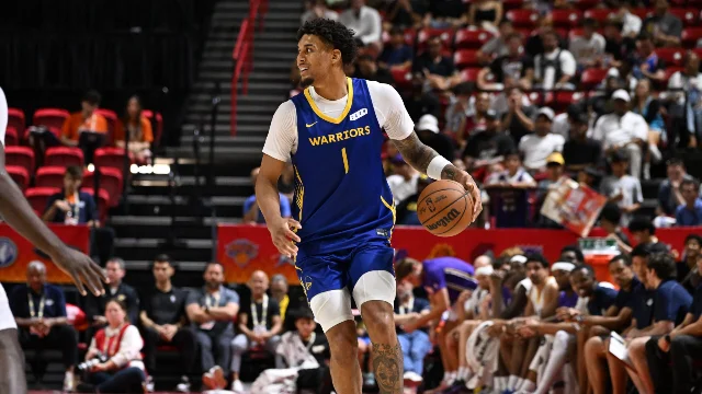 A Warriors player brings the ball up during Las Vegas Summer League action