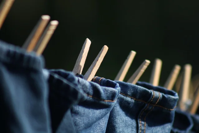 Denim jeans clipped to a clothesline