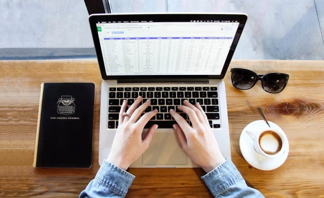 Laptop and notebook on a clean desk