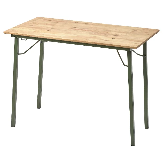 Light pine KOMPISHÄNG desk with green metal legs, shown on a white background.