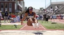 Tara Davis-Woodhall in mid-flight during the long jump competition at the USATF LA Grand Prix