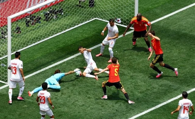 Alireza Beiranvand challenges for the ball in Belgium vs Iran