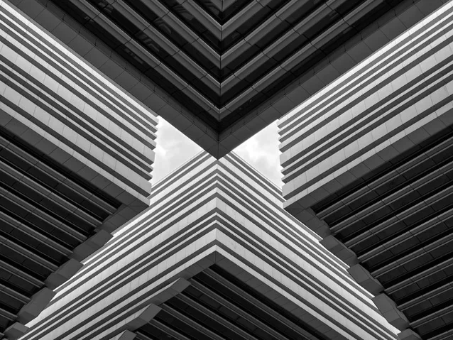 Black and white geometric modern architecture with precise straight lines and angular forms — architecture prompts require geometry-focused negatives that differ from every other genre