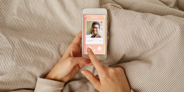 Person on a smartphone browsing a dating app