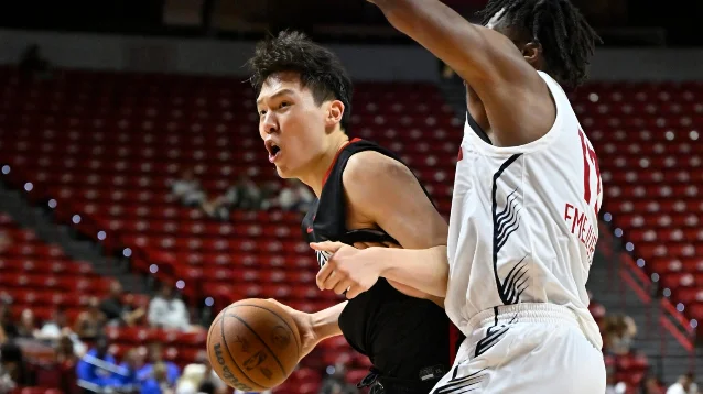 Yang Hansen of the Portland Trail Blazers attacks the basket against the Denver Nuggets in Las Vegas.