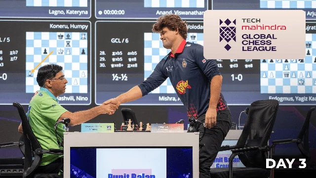 Viswanathan Anand and Magnus Carlsen shake hands over the board during round three in Bengaluru
