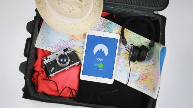 Open suitcase with travel items laid out