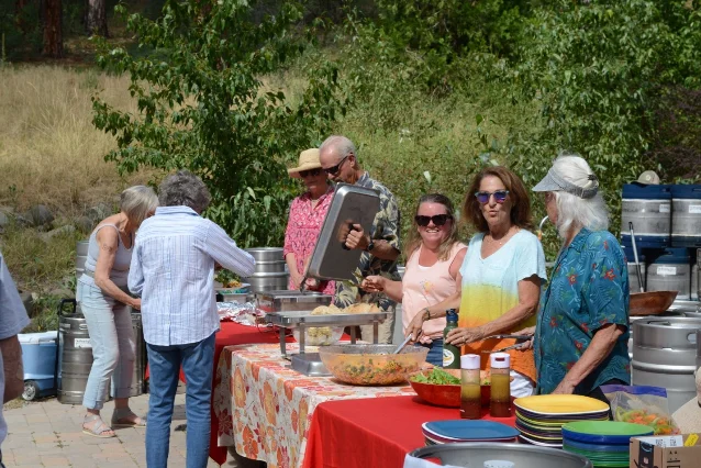 Volunteers serve food at the Plumas Community Hospice fundraiser at the Brewing Lair.