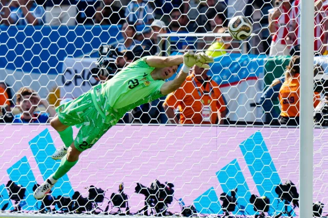 Emiliano Martínez reaches for a shot during the 2026 World Cup final.