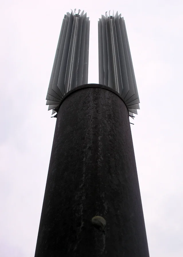 A vertical support member topped by two heat-pipe radiators