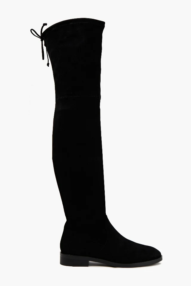 Stuart Weitzman Jocey over-the-knee boots in black suede, photographed at an angle against a plain background
