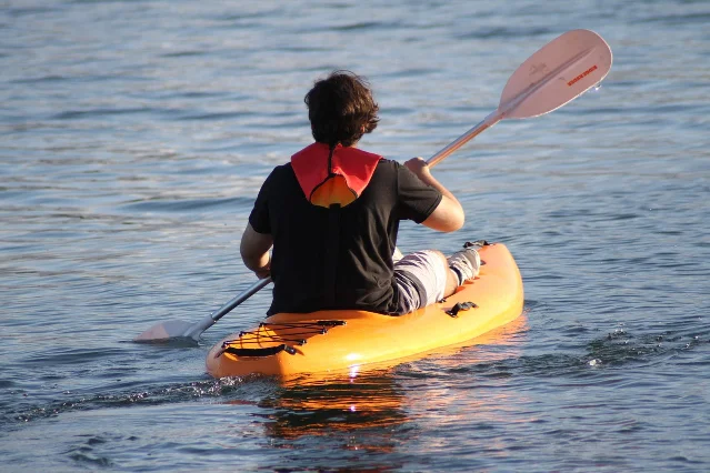 Kayaking river trip with outdoor gear — the kind of activity where prevention takes 30 seconds of prep