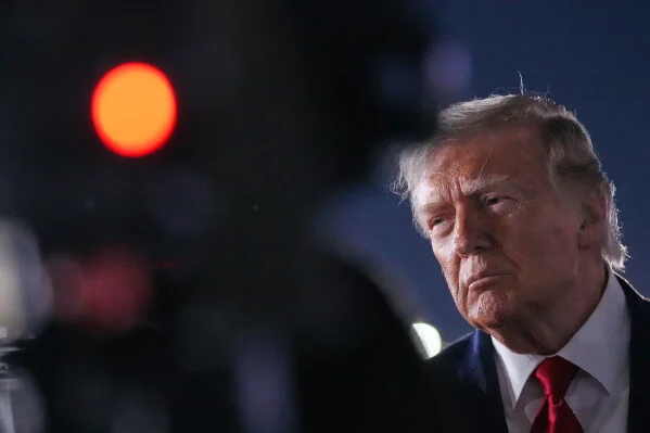 Trump speaks to reporters before boarding Air Force One at JFK Airport, early June 9, 2026.