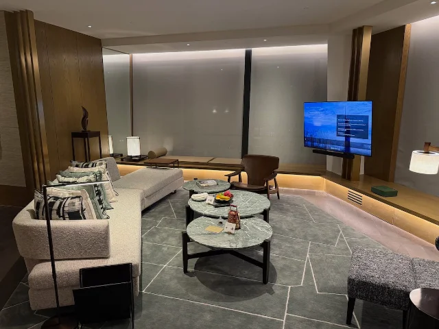 Park Hyatt Kuala Lumpur — suite interior with modern furniture, marble tables, and warm lighting