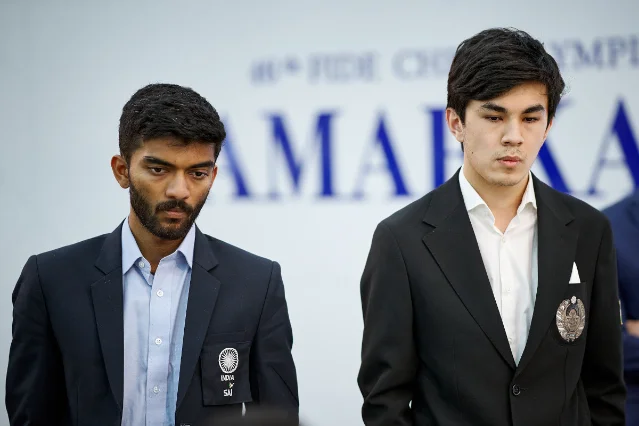 Gukesh Dommaraju and Javokhir Sindarov watching the round-nine match