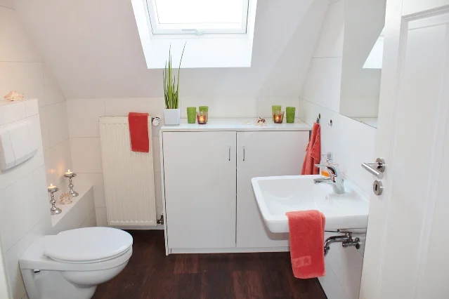 Bright bathroom with a clear sink and cabinet
