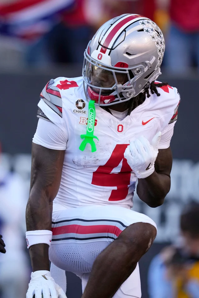 Ohio State receiver Jeremiah Smith celebrates a touchdown catch at Iowa