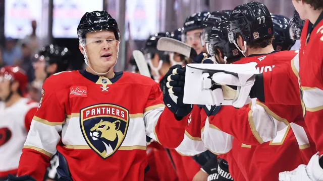 Florida Panthers players celebrate on the bench during their preseason opener against the Carolina Hurricanes