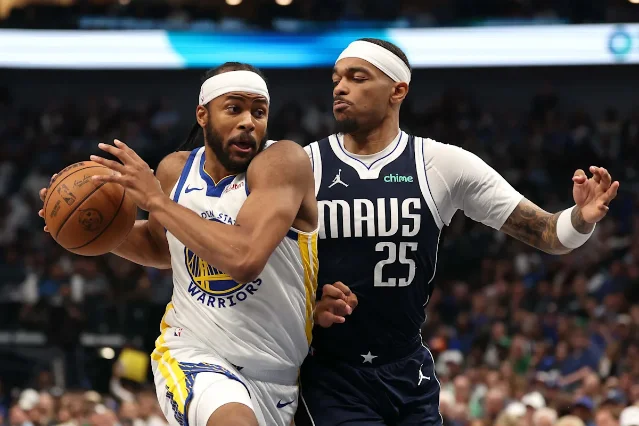Moses Moody of the Golden State Warriors drives against Dallas