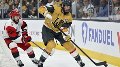Brayden McNabb wearing full cage after facial injury, during Game 3 warmups at T-Mobile Arena
