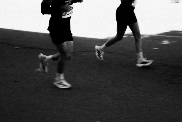 Black and white marathon runners in motion