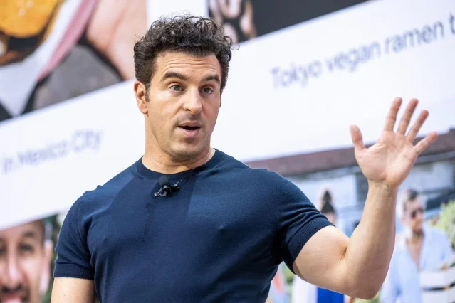 Airbnb CEO Brian Chesky speaking at a public event