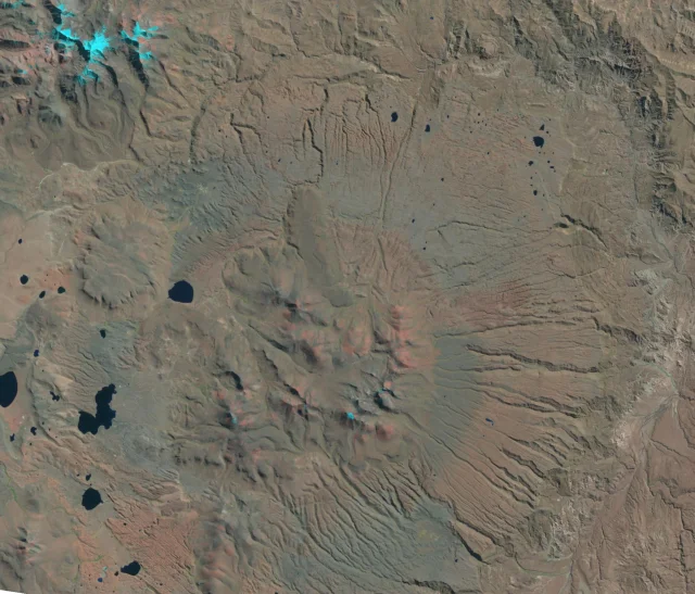 Satellite view of the Cerro Panizos ignimbrite shield, central dome complex, rugged volcanic terrain, and dark lakes