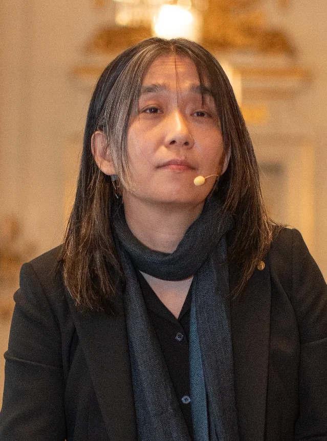 Portrait of Han Kang speaking at a 2024 literary event