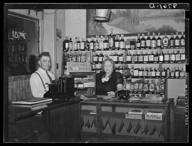 Original black-and-white interior of the Alamo bar with manager and Mildred Irwin