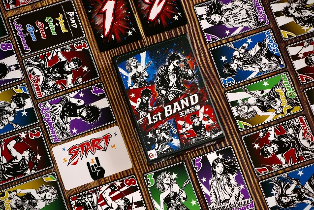 1st Band card game components spread on a wooden table
