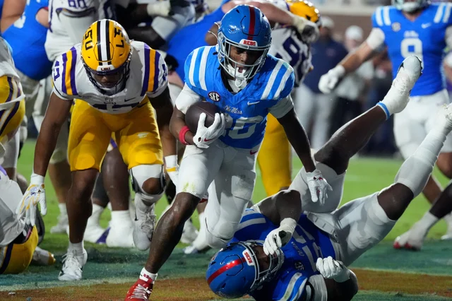 Ole Miss running back JT Lindsey drives into the end zone for a two-point conversion against LSU