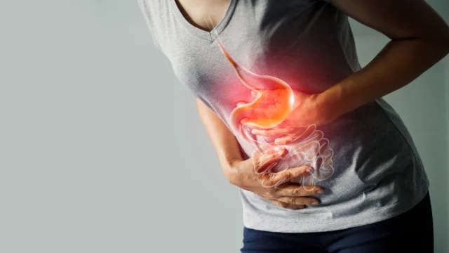 Person holding their stomach